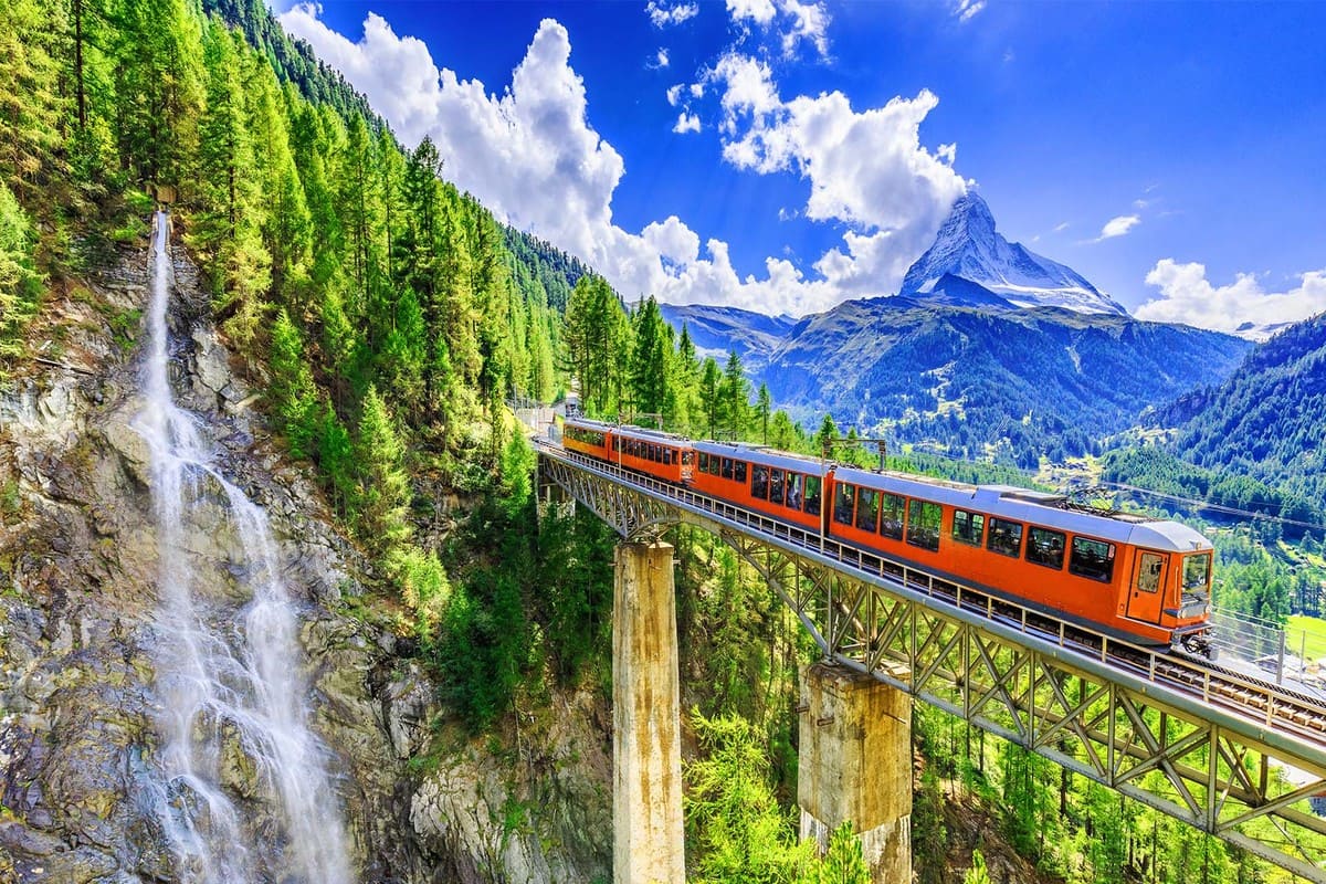 The World's Most Scenic Train Journeys 2 scenic-train-journey-through-mountains-and-waterfall