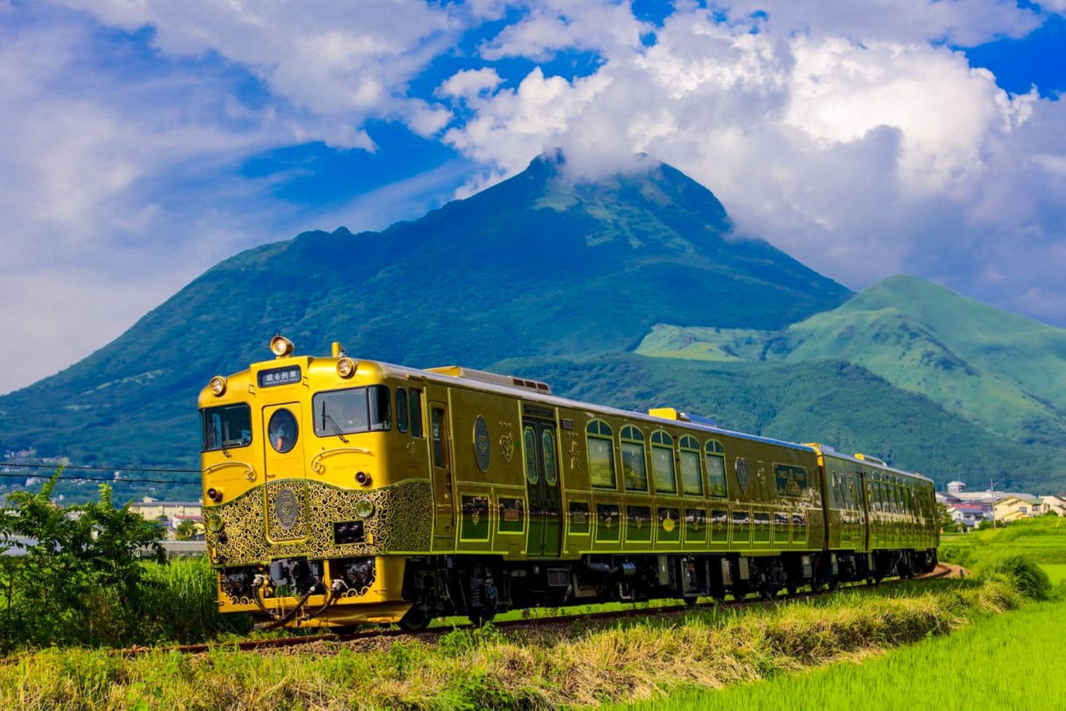 The World's Most Scenic Train Journeys 6  the-sweet-train-in-japan-with-lush-mountain